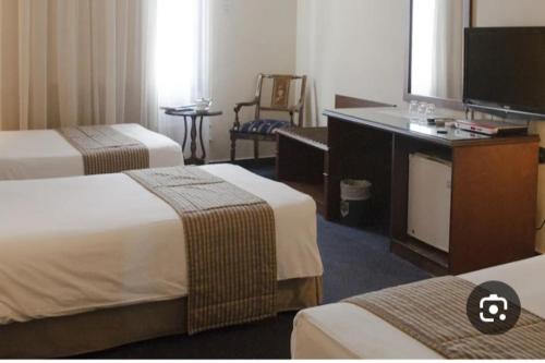 Ένα ή περισσότερα κρεβάτια σε δωμάτιο στο Grand Museum Pyramids