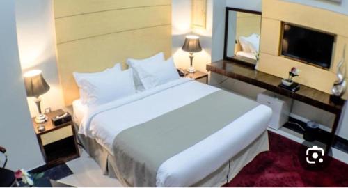 Ένα ή περισσότερα κρεβάτια σε δωμάτιο στο Grand Museum Pyramids