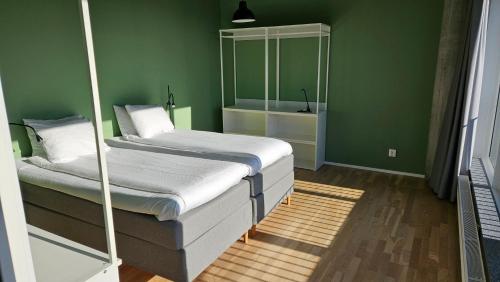 Ένα ή περισσότερα κρεβάτια σε δωμάτιο στο Place Lund Apartments