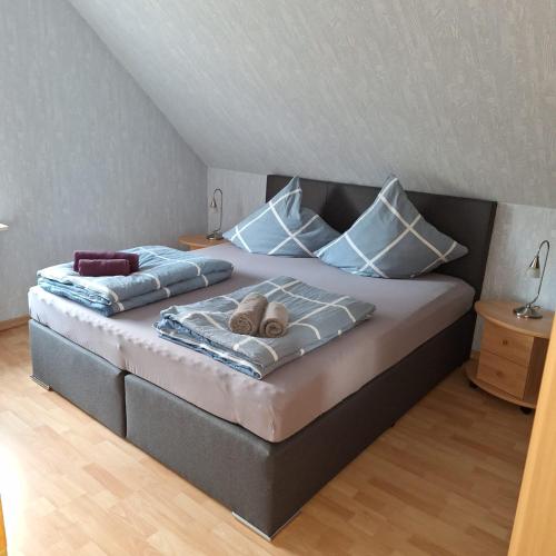 a bed with two pillows on it in a room at Niki in Geesthacht