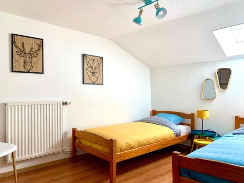 Llit o llits en una habitació de La Petite Lorraine