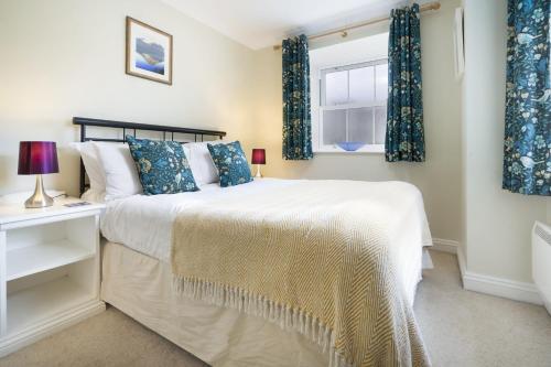 a bedroom with a bed and a window at The Screes Apartment - Short stroll from Wastwater in Nether Wasdale
