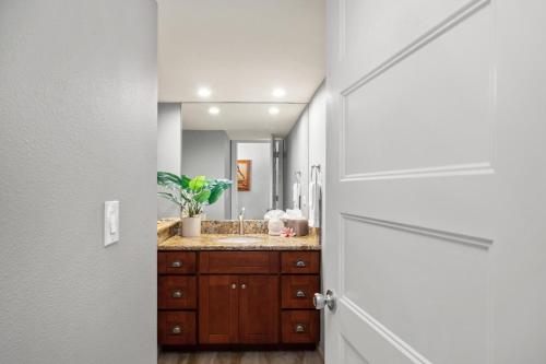 a bathroom with a sink and a mirror at Lahaina Shores 234 in Wainee