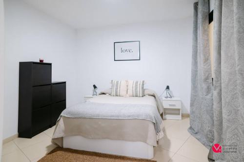Postel nebo postele na pokoji v ubytování Apartamento Media Noche