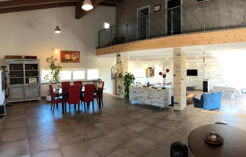 a living room with a kitchen and a dining room at Loft Irene With Private Pool in Tergu