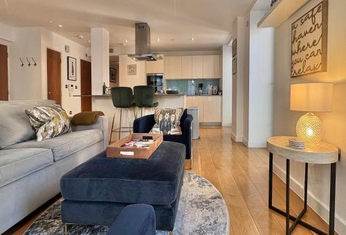 a living room with a couch and a table at Westminster Luxury Two Bed Two Bath with Air-Con in London