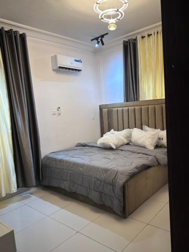 a bedroom with a bed in a room at Ofili Homes in Lekki