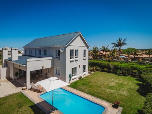 an aerial view of a house with a swimming pool at Sidwell Gardens, Adjacent to Kingswood Estate in George