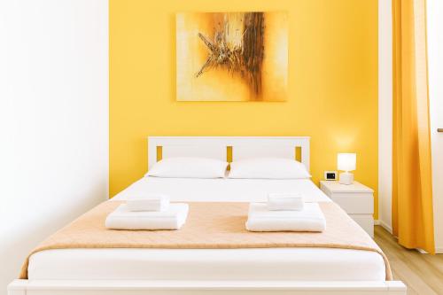 Postel nebo postele na pokoji v ubytování Iris Rooms