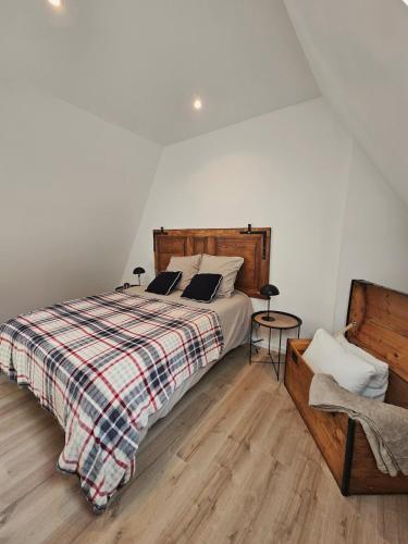 a bedroom with a bed with two pillows on it at Gîte a la source in Bergholtz-Zell