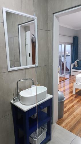 a bathroom with a sink and a mirror at 27 on Brunswick in Gqeberha