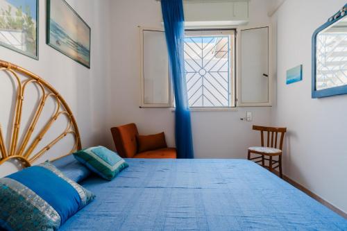 En eller flere senge i et værelse på Villetta Nathalie by BarbarHouse