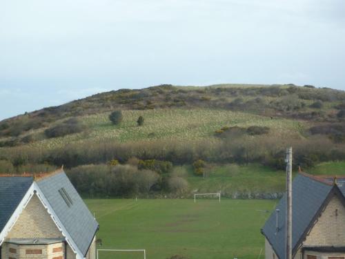 a soccer field with a soccer ball on a hill at Varley House in Ilfracombe