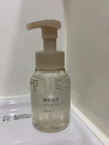 a bottle of soap sitting on top of a sink at 8108 yadoya in Ogori