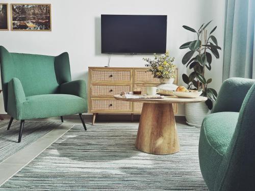 TV a/nebo společenská místnost v ubytování Grace Living