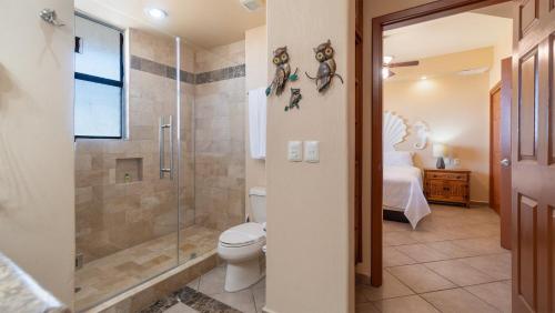 a bathroom with a toilet and a shower at Rubi 805 1 BR 1BA Condo Phase 1 @ Las Palomas in Puerto Peñasco