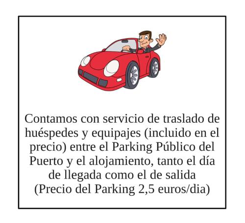 a man in a red car at El Pixueto Amarillo in Cudillero