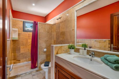 a bathroom with a sink and a shower at Villa Tania in Playa Blanca