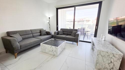 Et opholdsområde på Pool Citylux Apartment