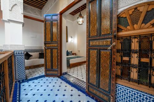 an entrance to a room with an open door at Riad Dar Sira in Fès