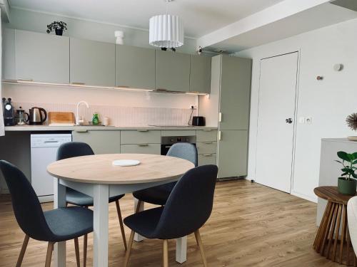 a kitchen and dining room with a table and chairs at Hotel Chantereyne in Cherbourg en Cotentin