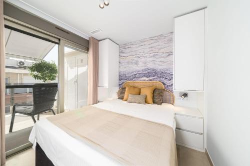 En eller flere senge i et værelse på Torrevieja Spain Apartments - Solina & Nerisa