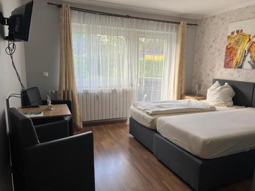 Ένα ή περισσότερα κρεβάτια σε δωμάτιο στο Pension Casa Ambiente