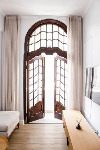 a room with a large window and a large door at The Burg Collection - Suite 2 in Cape Town