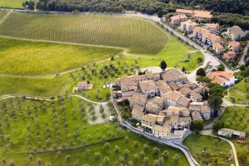 an aerial view of a village in a field at Borgo San Gusmè in San Gusmè