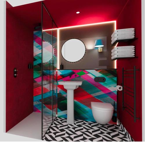 un bagno con un water e un lavandino di The Kensington Hideaway a Londra