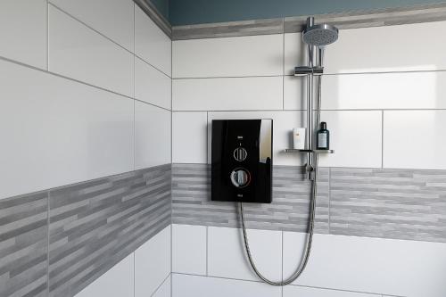 a shower with a speaker in a bathroom at 1 Bed - Sleeps 2 - Free Parking - Wi-Fi in Herne Bay