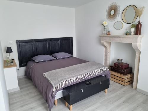 Postel nebo postele na pokoji v ubytování le gîte de Constance