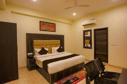 a bedroom with a large bed in a room at Hotel Blist villa in New Delhi