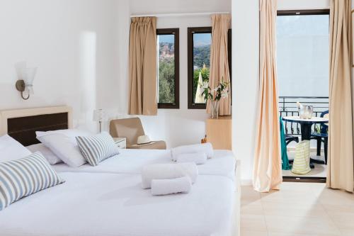 Ένα ή περισσότερα κρεβάτια σε δωμάτιο στο Paradise Hotel-Apartments 