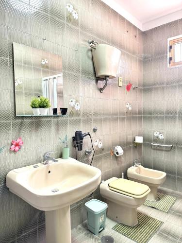 a bathroom with a sink and a toilet at Alba Vesuviana B&B in Poggiomarino