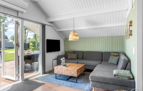 a living room with a couch and a table at 2 Bedroom Beautiful Home In Egernsund in Egernsund