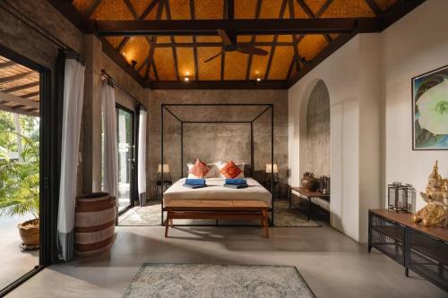 a bedroom with a bed with pillows on it at Shanti Rock Residence Koh Phangan in Ko Kong Nui