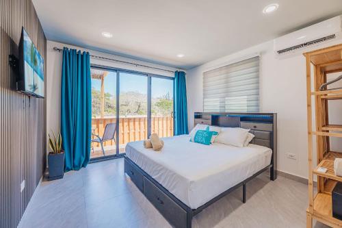 a bedroom with a large bed and a balcony at Private Suite HotTub in Santa Cruz