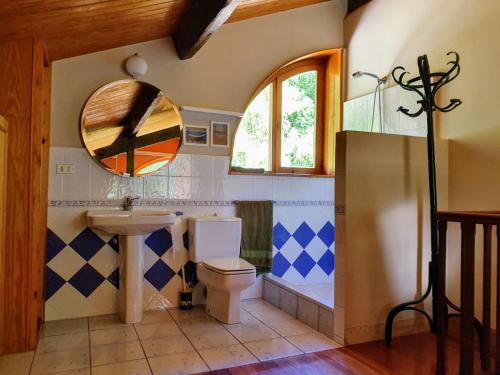 a bathroom with a sink and a toilet at Villa Elorrio in Elorrio