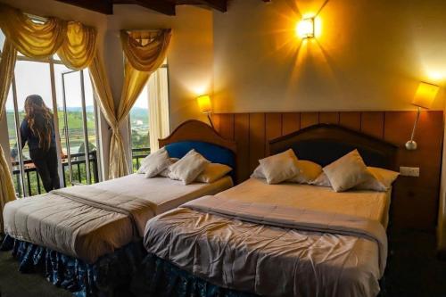 Postel nebo postele na pokoji v ubytování Hill Paradise