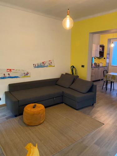 a living room with a couch and a table at Pinerolo medievale in Pinerolo
