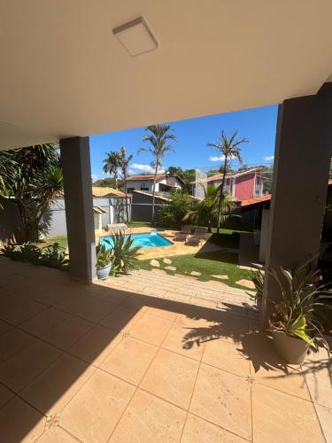 a view of a swimming pool from a house at Casa Jaguariúna in Jaguariúna