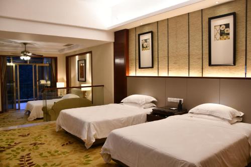 Ένα ή περισσότερα κρεβάτια σε δωμάτιο στο Country Garden An'an Residence