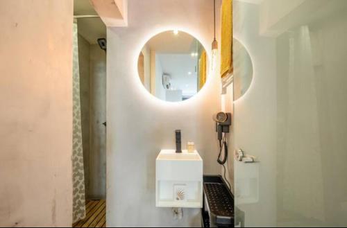 a bathroom with a sink and a mirror at Typical Lisbon center in Lisbon