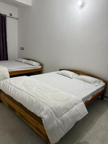 Postel nebo postele na pokoji v ubytování Grazioso Home Stay