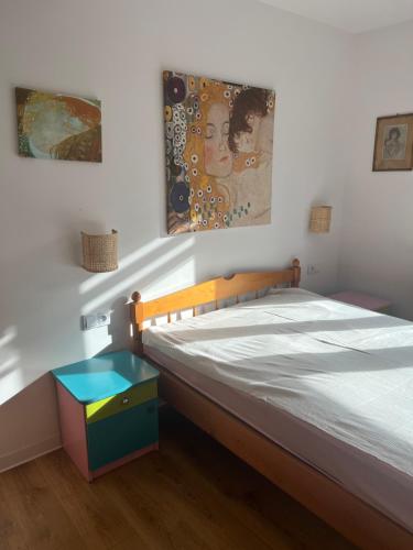a bedroom with a bed with a wooden frame at Ruczaj Cozy Room in Krakow