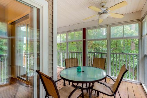 a screened porch with a glass table and chairs at Sea Colony - 55049 Pine Lake Dr in Bethany Beach