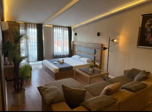 a living room with a bed and a couch at OTTO Boutique in Ankara