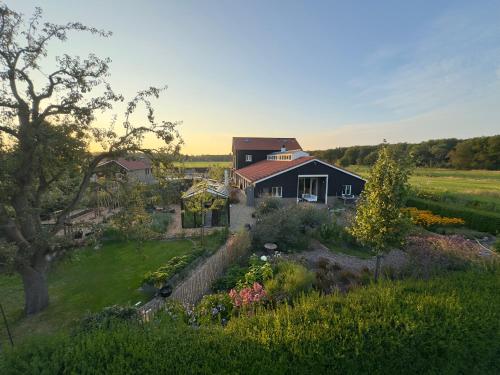 an aerial view of a house with a garden at Vakantiehuis Noflik Nijemirdum in Nijemirdum