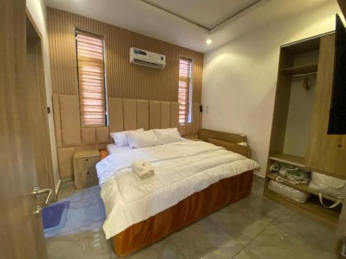 a bedroom with a large bed in a room at DLA Lux Studio in Ikota, Lagos in Lekki